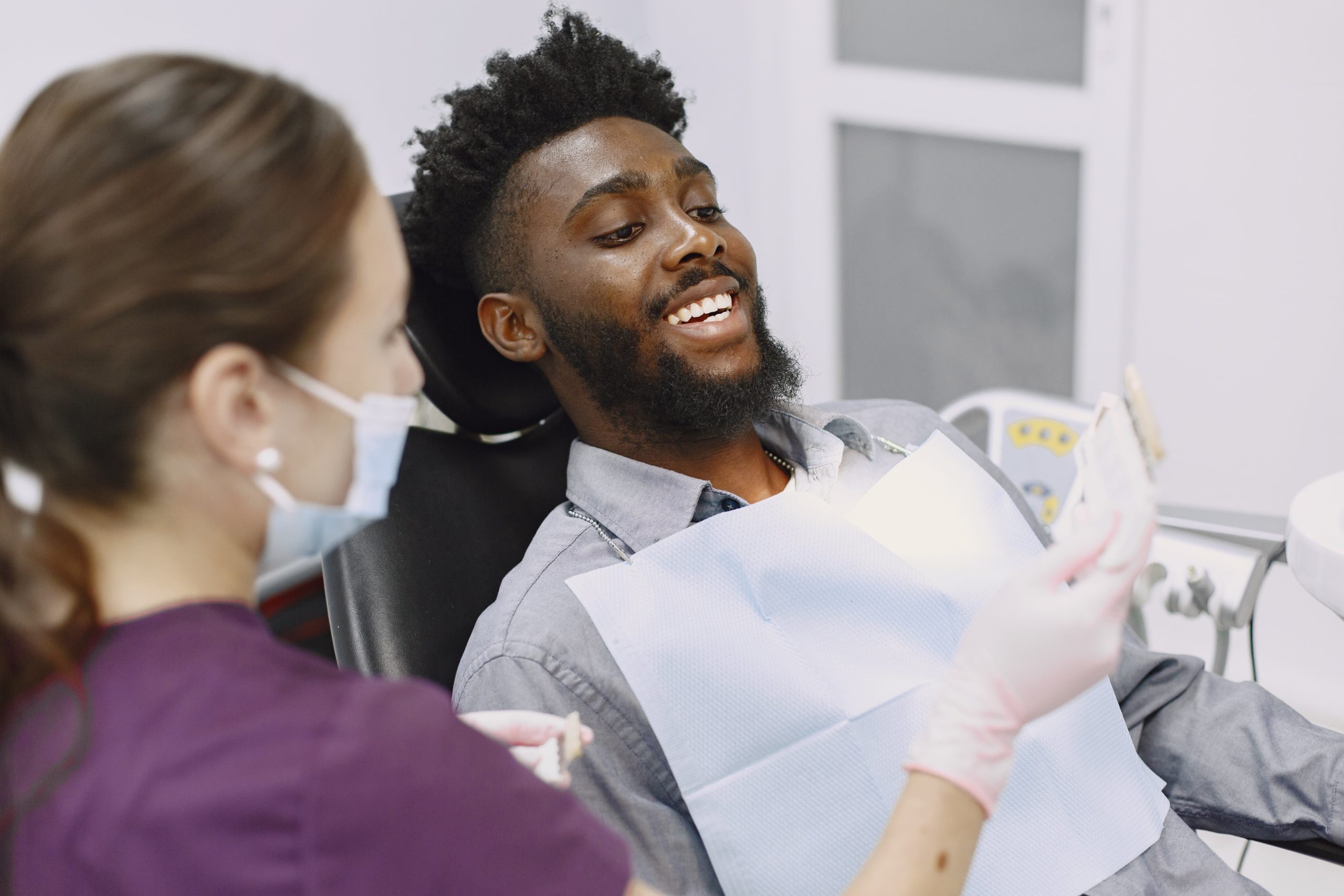Dental Hygiene - Kensington Court Clinic - what you can expect from the appointment - man has review with dental hygienist